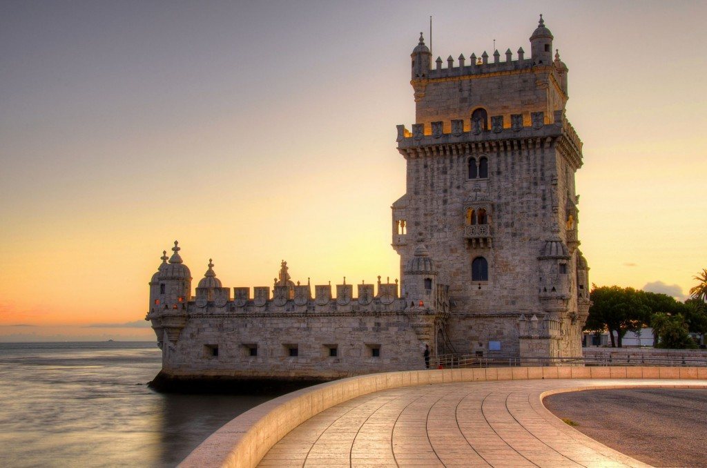 A sunset behind Belém Tower in Lisbon, Portugal