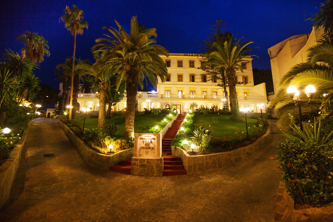 grand hotel villa de france outside night